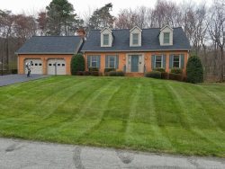 Brick House with freshly mowed lawn